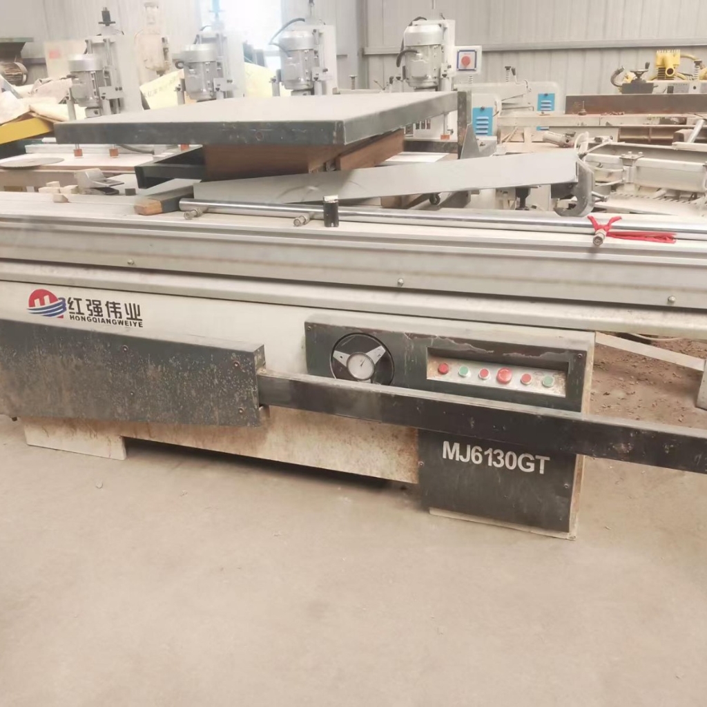 Used industrial sliding table panel saw machine for heavy-duty woodworking and MDF board cutting.